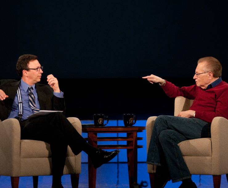 Frank Sesno and Larry King speak on the Jack Morton Auditorium stage.