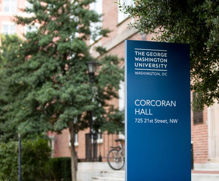 Corcoran Hall and its name pylon as seen from the front.