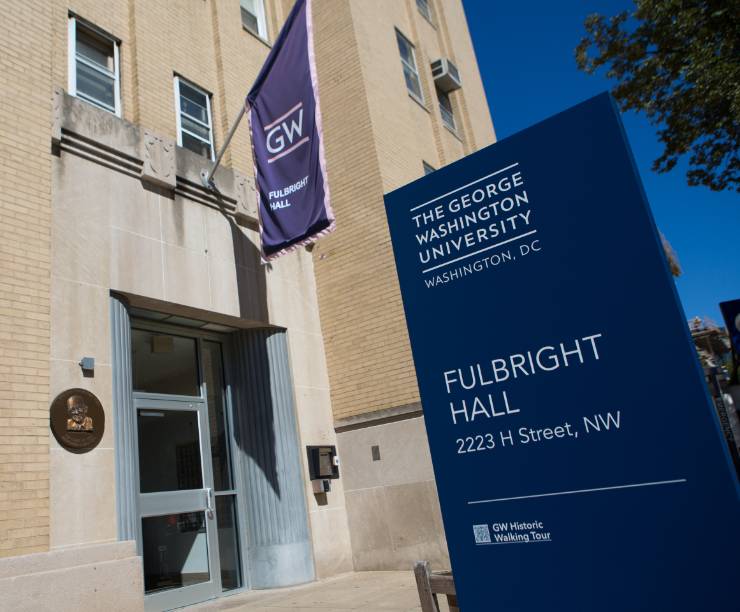 Fulbright Hall and name pylon at front of building.