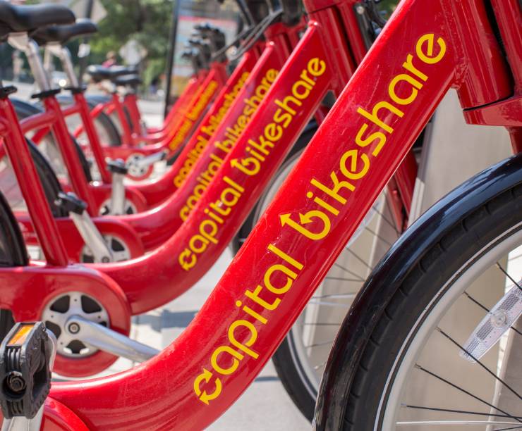 Capital Bikeshare bikes in a row at the station.