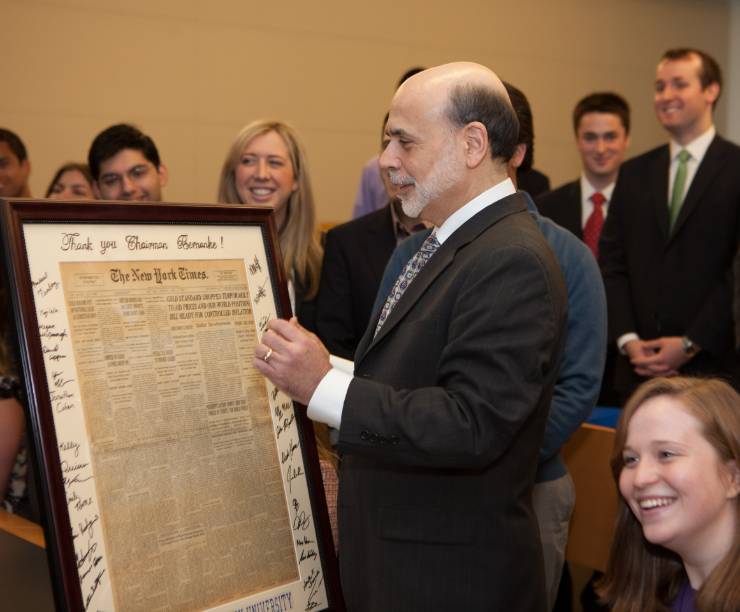Ben Bernanke receives a gift from a group of students.