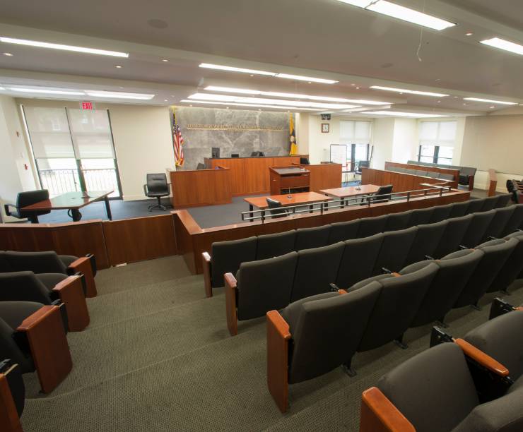 The Jacob Burns Moot Court Room is set up like a courtroom and includes a judge's desk, testimony seat, prosecution and defense tables, chairs for viewing trials as well as computer terminals, video monitors and projectors, and voice-activated transcription recorders.