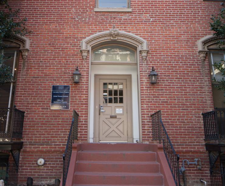 The front steps and brick facade of 714 21st Street as seen from front.