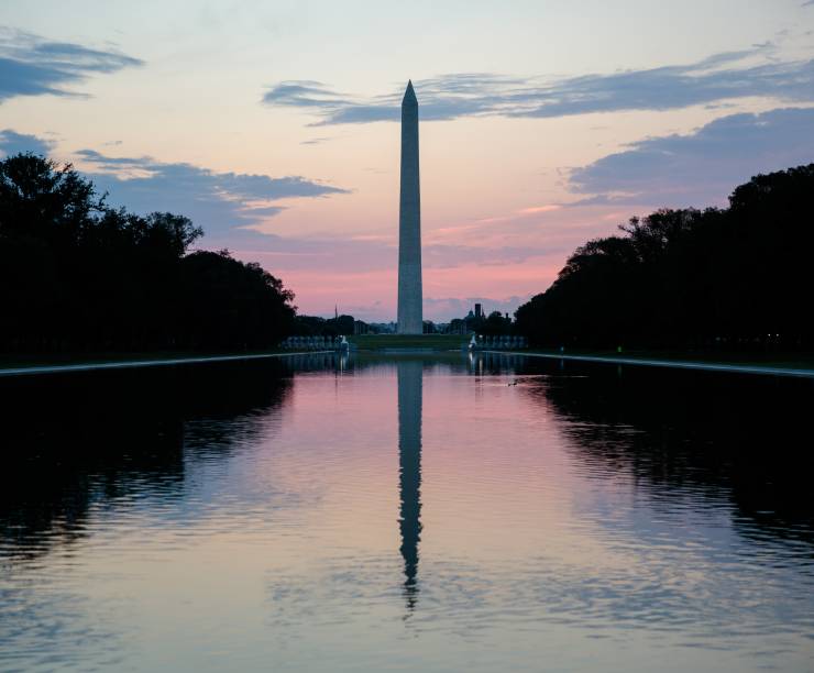Washington Monument and the reflecting pool at dusk.