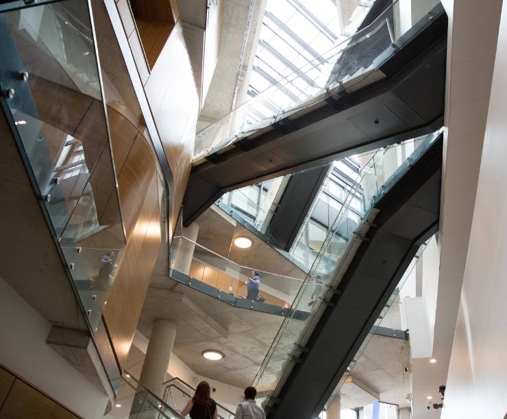 Steel stairways crisscross a central atrium.