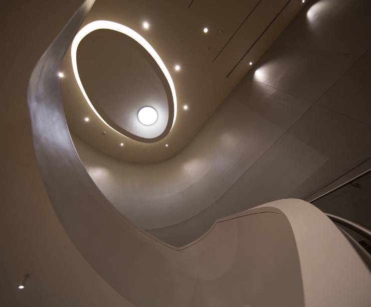 The view up an oval staircase.