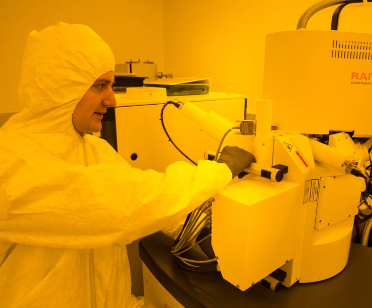 Student working with nanotechnology equipment in the clean room