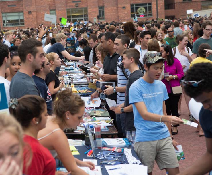 Students attend a student organization fair on University Yard.