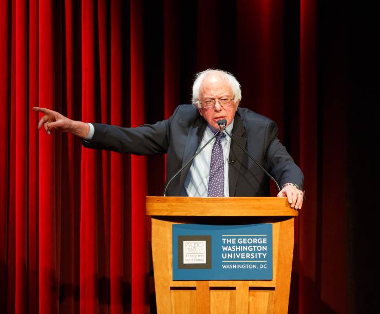 Senator Bernie Sanders speaks at podium in Lisner
