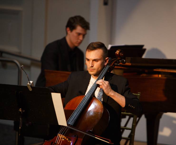 A cellist and pianist perform.