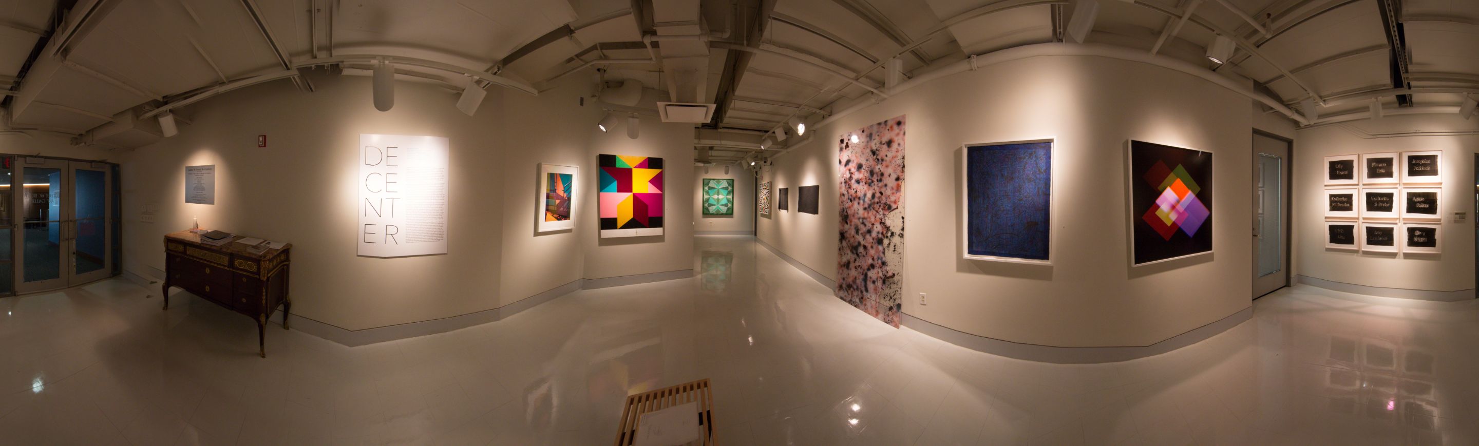 A panoramic view of a painting exhibition.