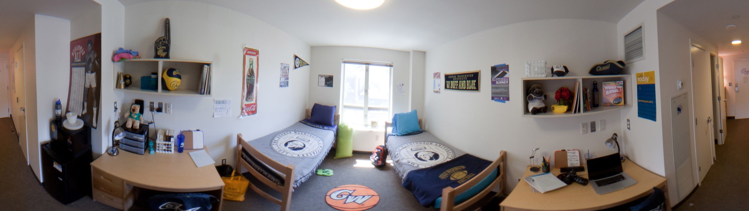 A panoramic view of a double residence hall room.